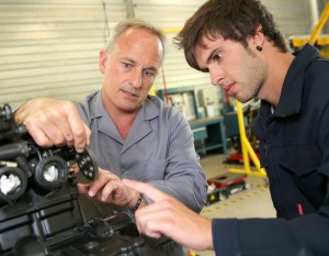 http://www.dreamstime.com/stock-photo-young-man-business-training-teacher-student-mechanics-working-bike-image32144860